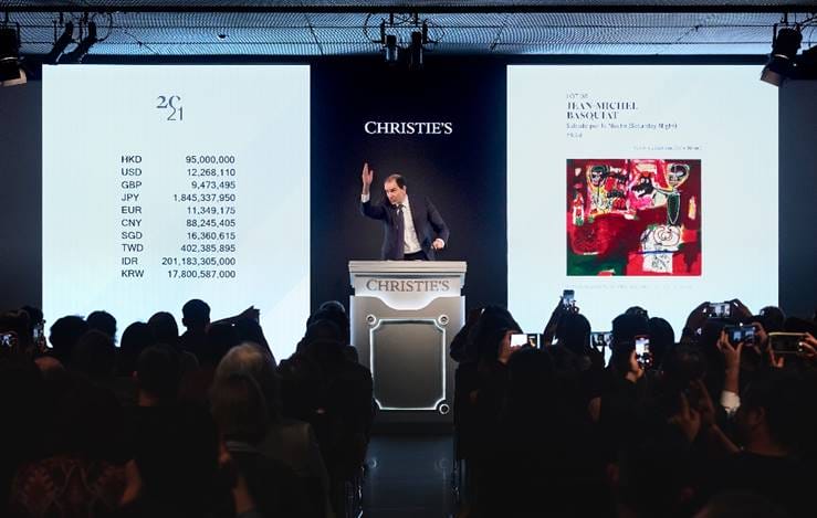 Auctioneer Adrien Meyer selling Jean-Michel Basquiat’s Sabado por la Noche (Saturday Night) (HK$112,625,000 / US$14,544,212) during Christie’s 20th / 21st Century Evening Sale in Hong Kong