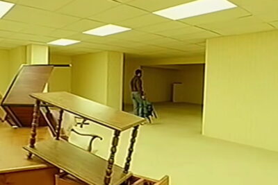 A still from Backrooms, Kane Parsons's feature debut: a figure in the endless yellow corridors of the internet's most famous liminal space.