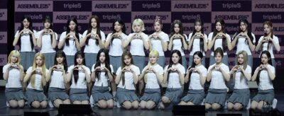 tripleS members performing on stage at a music showcase