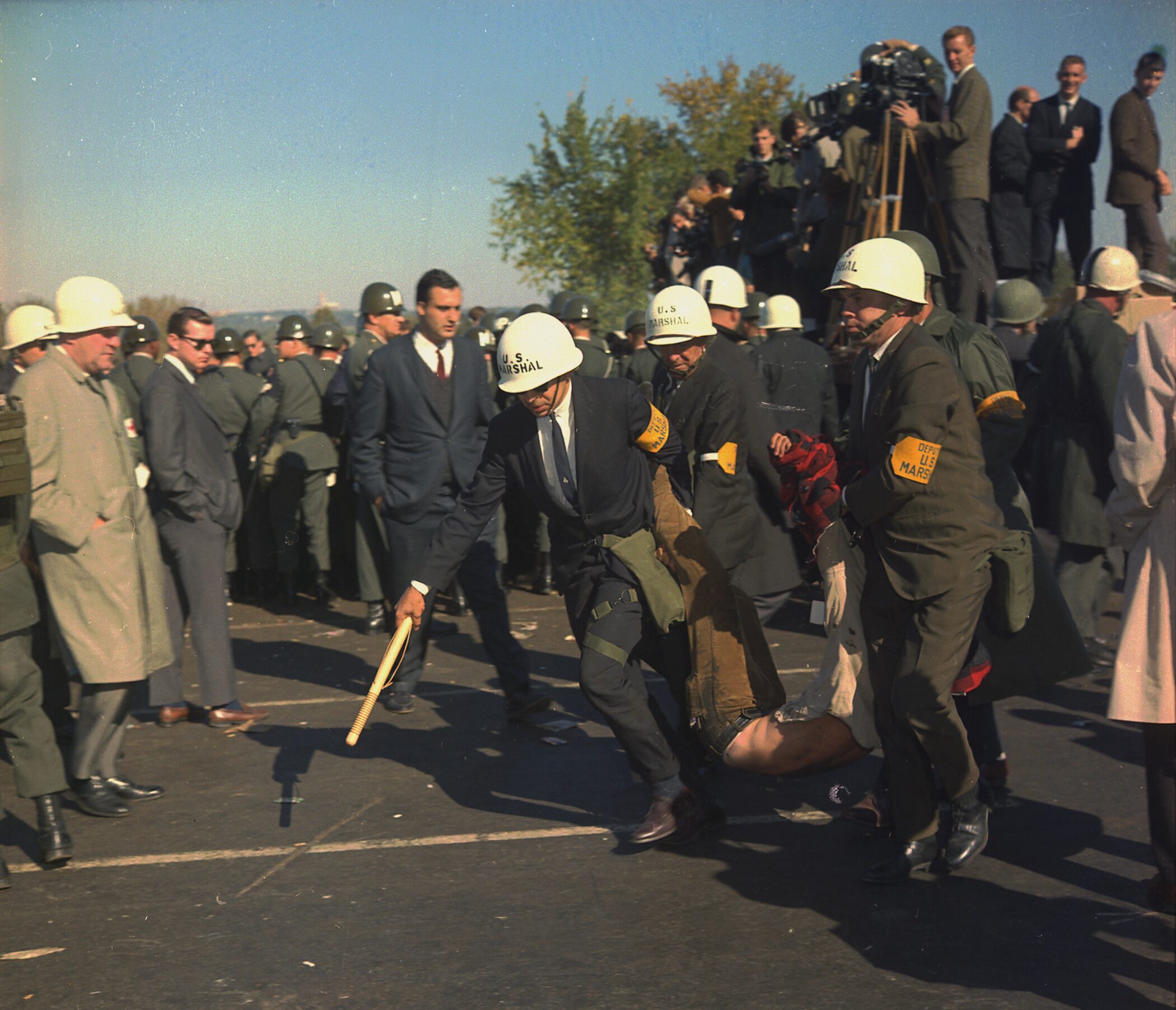 U.S. Marshals carry away an anti-war protester during a demonstration in Washington, D.C.