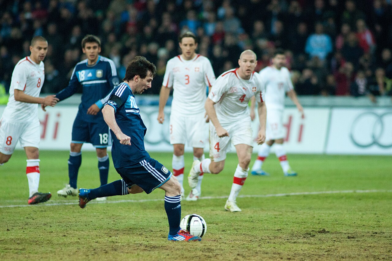 Lionel Messi strikes the ball in the Argentina shirt during an international match