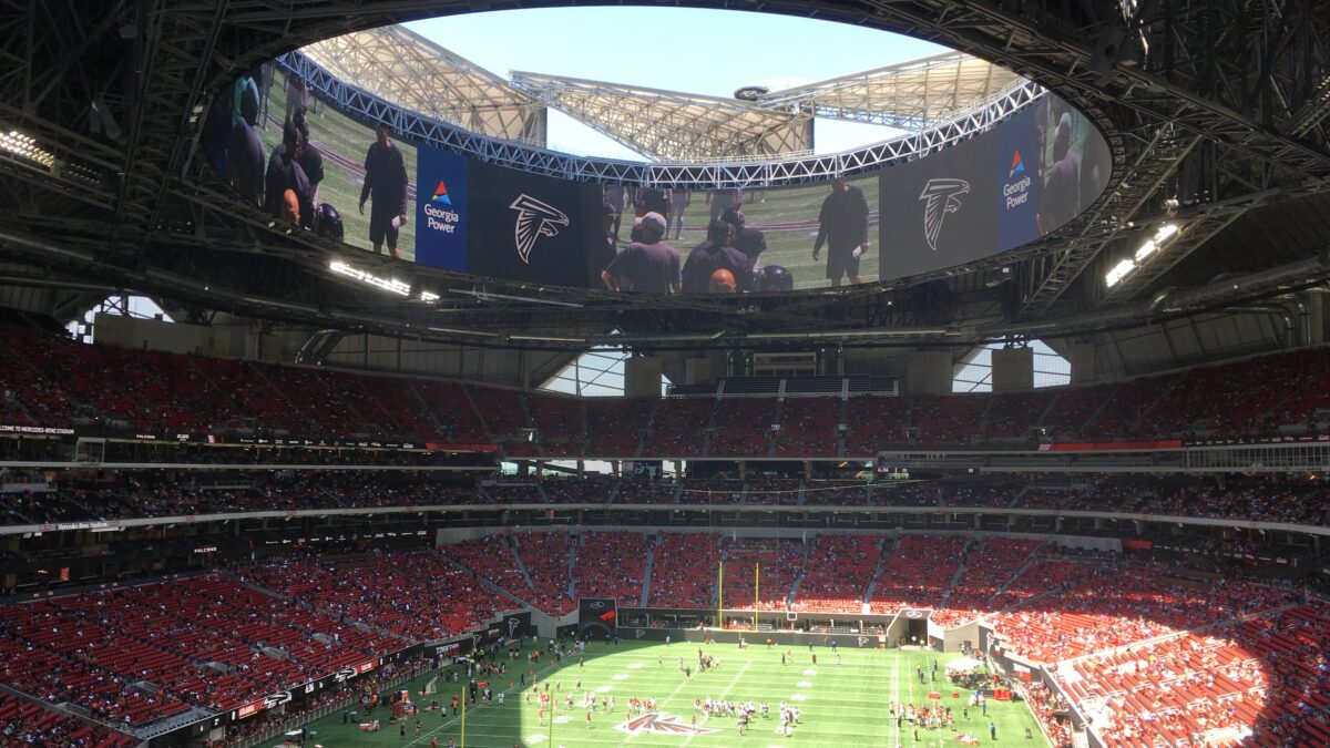 Mercedes-Benz Stadium interior with retractable roof open, home of Atlanta Falcons and Atlanta United