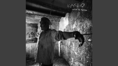 Still from Kase.O's official Camisa de Fuerza intro video on the YouTube Topic channel