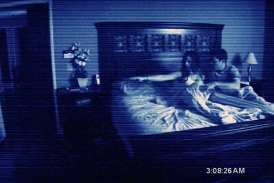 Night-vision bedroom still from the Paranormal Activity franchise