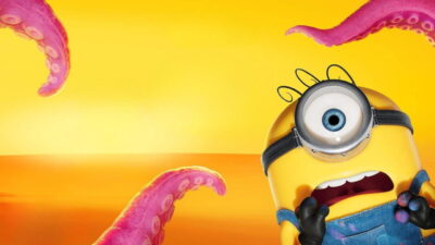 A wide-eyed Minion screams as pink monster tentacles rise against an orange sky in Pierre Coffin's animated film Minions & Monsters.