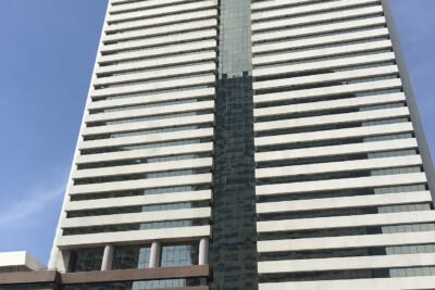 Standard Chartered bank branch exterior in Bangkok, Thailand, showing the bank's signage on a modern building facade.