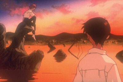 A still from Hideaki Anno's Neon Genesis Evangelion: Death and Rebirth, two figures beside a rust-red sea under an orange sky.