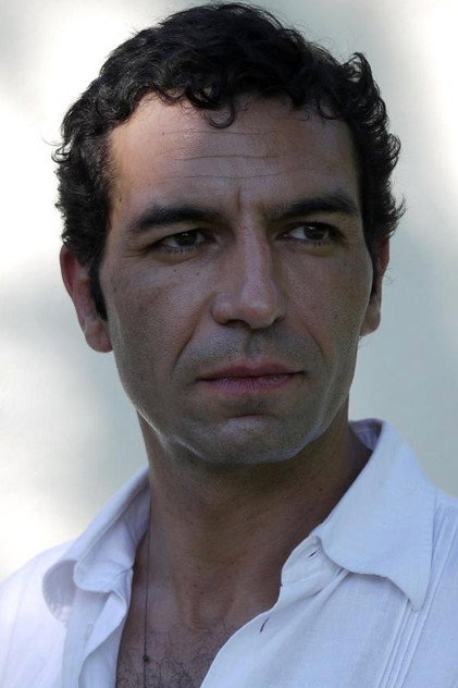Olivier Loustau as Lucien Scola