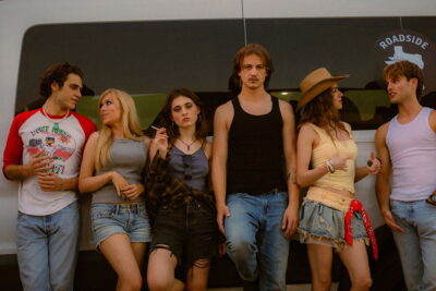 The festival-bound cast of Kristian McKay's horror thriller Kill Trip leans against a roadside van in Texas.