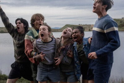 The teenage ensemble of George Jaques's film Sunny Dancer at a lakeside summer camp.