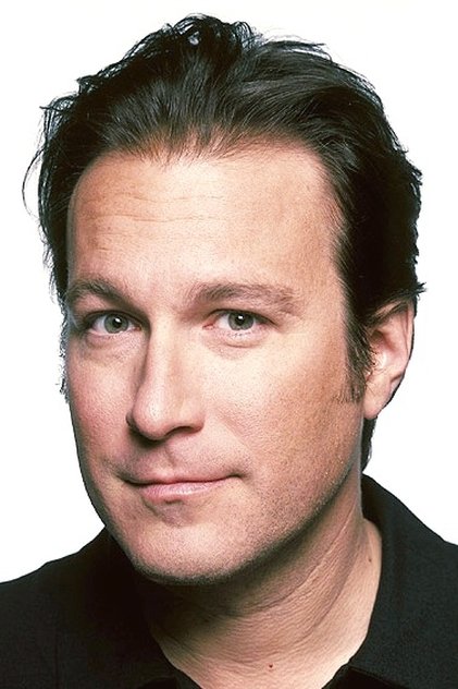 JOHN CORBETT como Daniel Covey