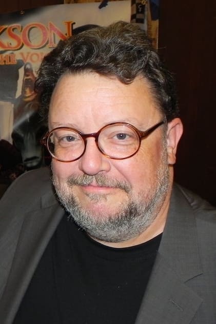 Roger L. Jackson as 'The Voice' (voice)