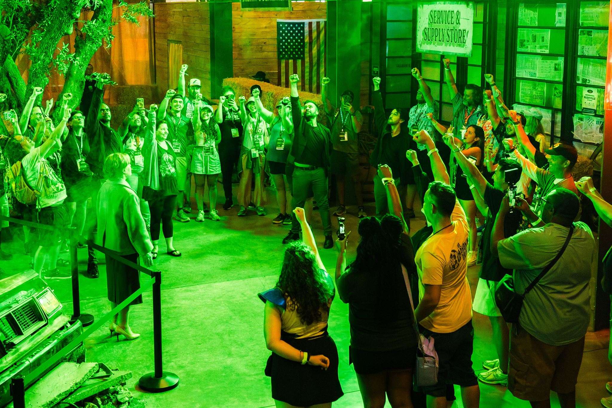 Fans raising their fists at the Lanterns Training Headquarters activation at Comic-Con