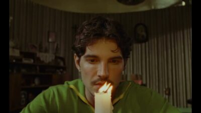 Promotional still from the official Memórias Póstumas trailer by Brazilian singer Jão
