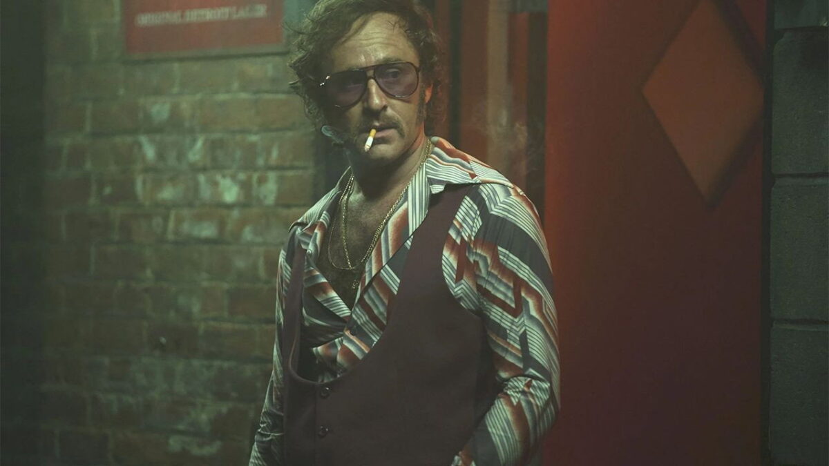 A period 1970s figure in a Detroit bar in Motor City 2026