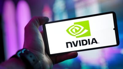 Person holding smartphone displaying NVIDIA logo