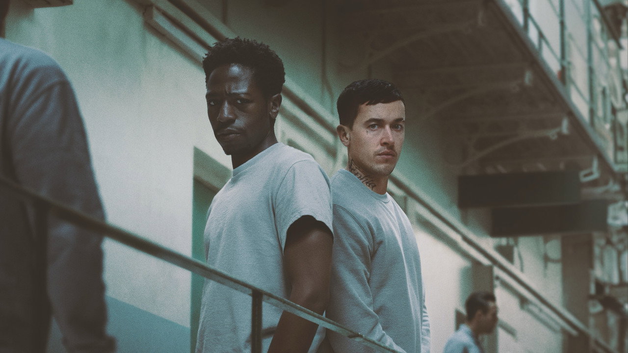 David Jonsson and Tom Blyth stand back to back in a prison wing in Cal McMau's Wasteman