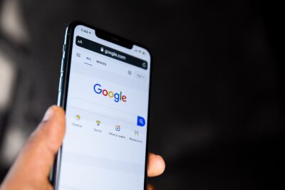 Google homepage on a smartphone screen — Google.com