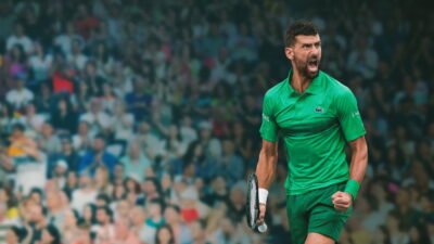 Novak Djokovic celebrates on court in a still from the Prime Video documentary The Wolf in Winter