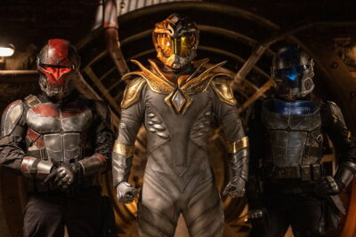 Three armored figures with the White Dragon at center in Aaron Schoenke's Legend of the White Dragon
