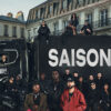 Cast and jury of Nouvelle École (Rhythm + Flow France) Season 5 in front of a black truck reading SAISON 5 on a Paris street