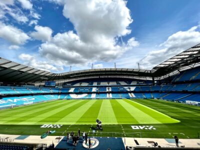 An empty Premier League stadium under the stands' roofline