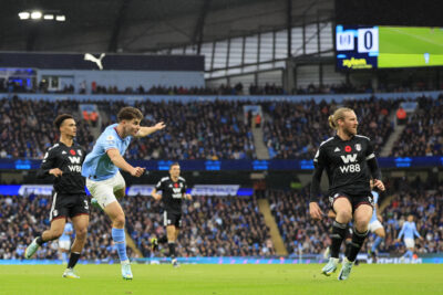 Premier League match action in a full stadium