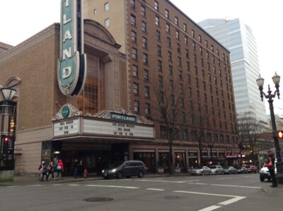 Bill Maher performing on stage at the Arlene Schnitzer Concert Hall