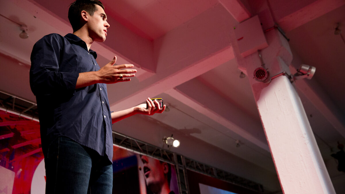Ryan Holiday speaking on stage at a conference