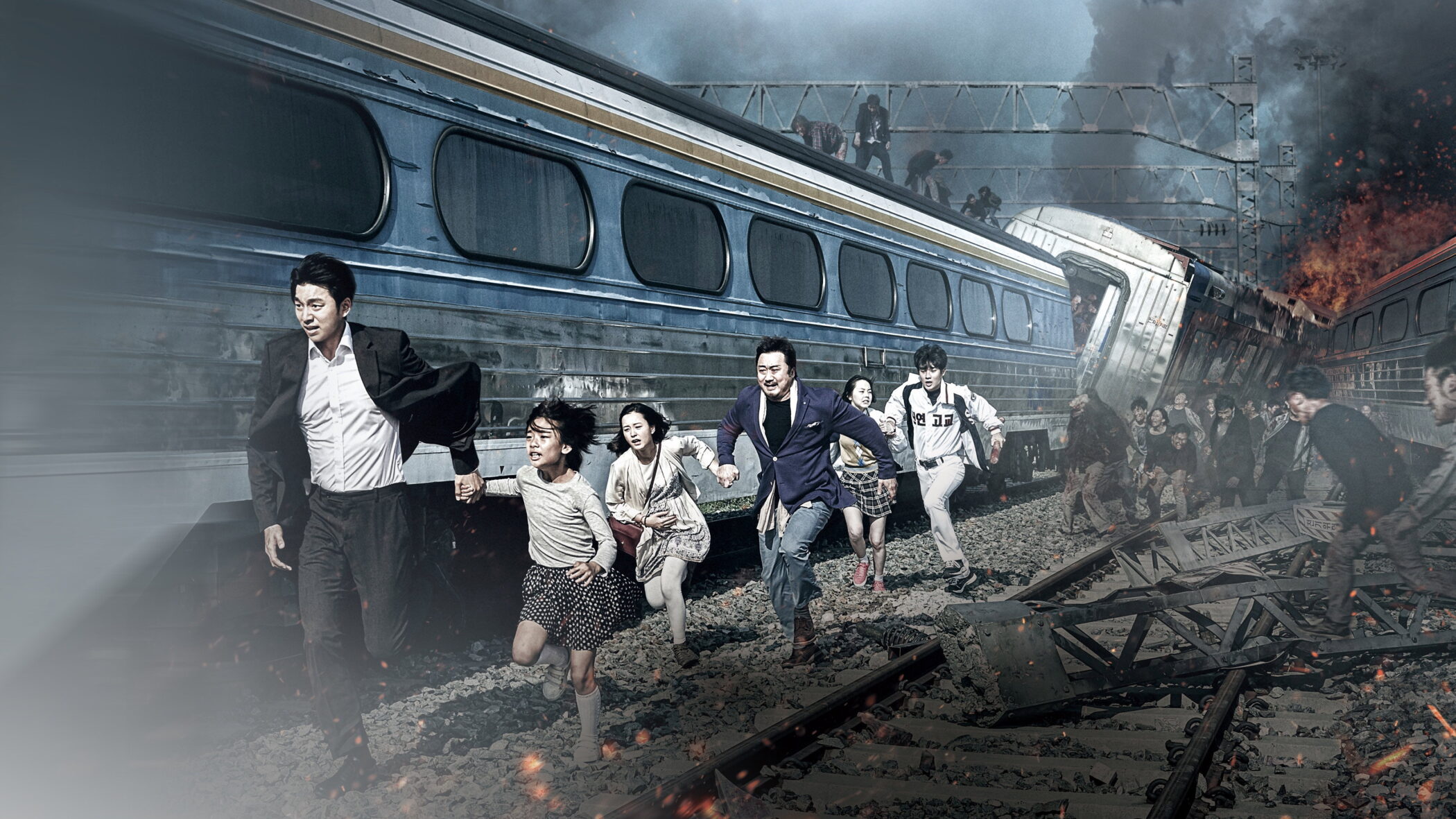 Passengers fleeing along the tracks beside a derailed train in Train to Busan