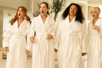 Leslie Mann, Isla Fisher, Michelle Buteau and Anna Faris in white robes react in shock in Jon Lucas and Scott Moore's comedy Spa Weekend