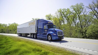 A Werner Enterprises semi-truck on a US highway, one of the largest truckload carriers in America