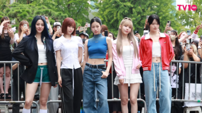 LE SSERAFIM group performing at Music Bank, wearing coordinated outfits on stage