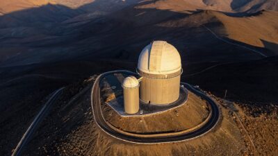 The ESO 3.6-metre telescope dome at La Silla Observatory in Chile, seen from above at sunset