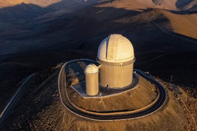 The ESO 3.6-metre telescope dome at La Silla Observatory in Chile, seen from above at sunset
