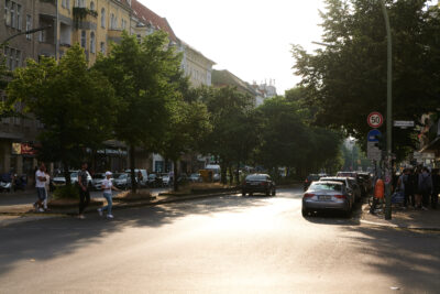 Sonnenallee street in Neukölln, Berlin, with pedestrians and classic apartment buildings