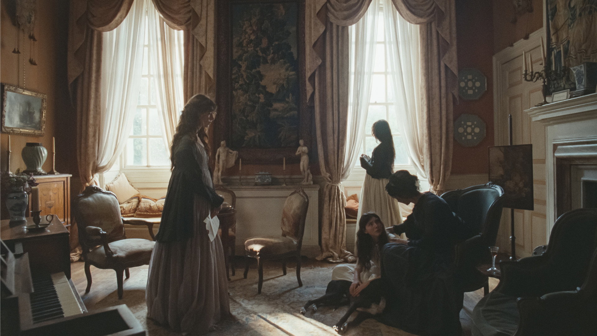 The Dashwood household in a Regency drawing-room scene from Georgia Oakley's film Sense and Sensibility.