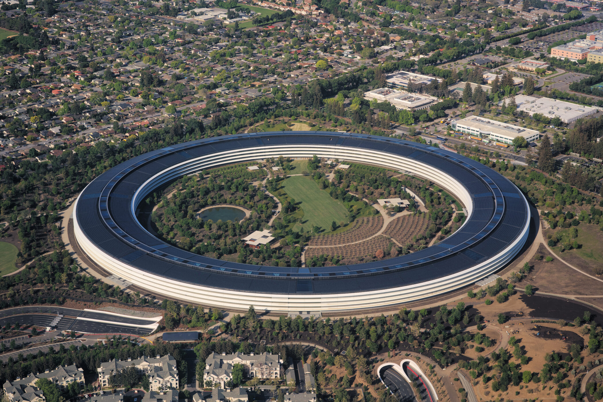 Aerial view of Apple Park, Apple's circular 'spaceship' headquarters in Cupertino, California — identifying landmark for Apple Inc. stories
