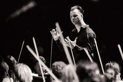 Conductor Teodor Currentzis, star of Ilya Khrzhanovsky's film DAU, leading the SWR Symphony Orchestra