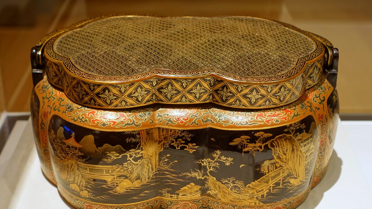 Qianlong-period lacquer handwarmer with landscapes, Qing Dynasty imperial craftsmanship