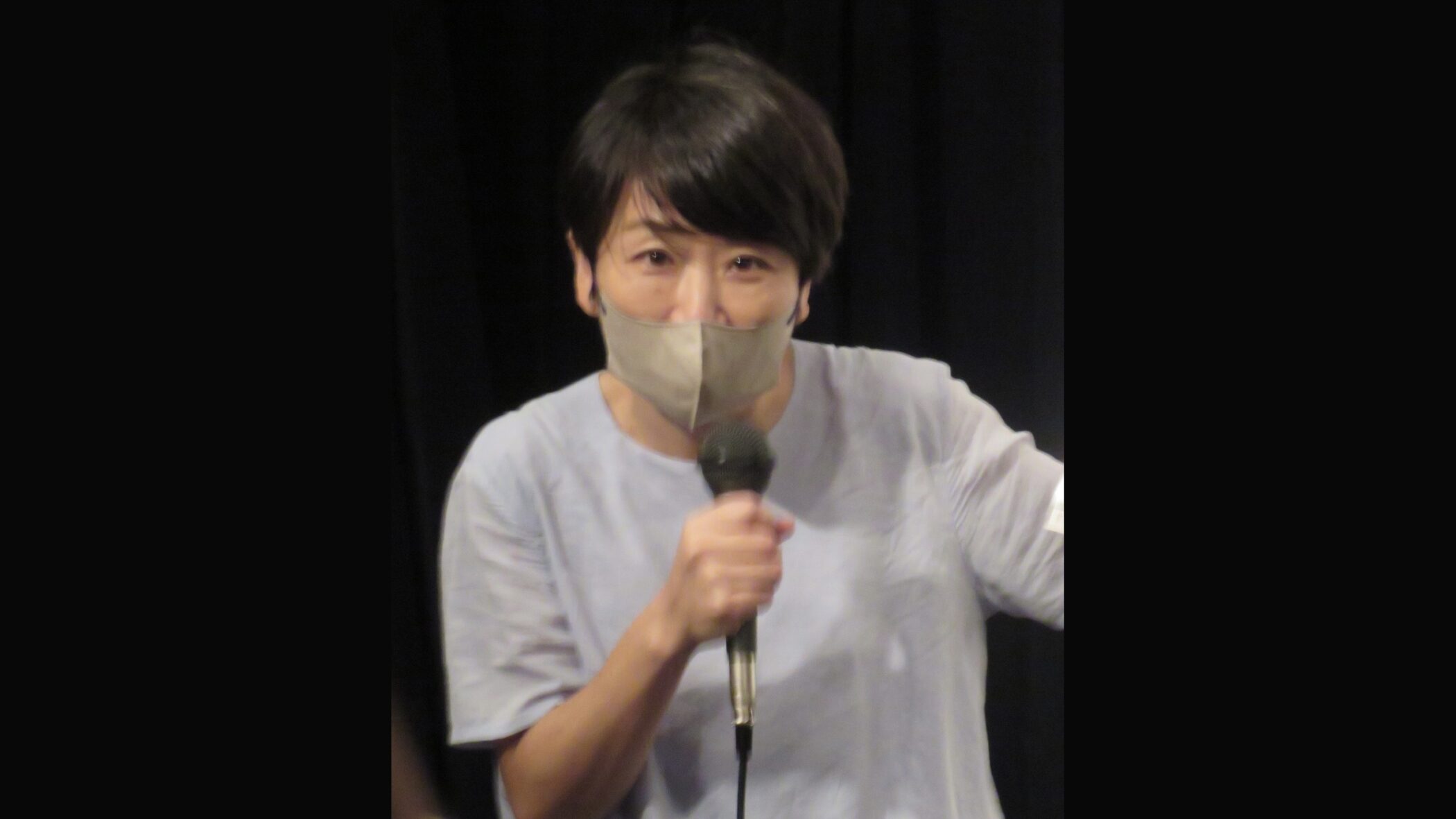 Japanese actress and singer Aki Maeda holding a microphone in 2023