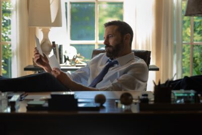 Ben Affleck reading at a desk in the Netflix film Animals