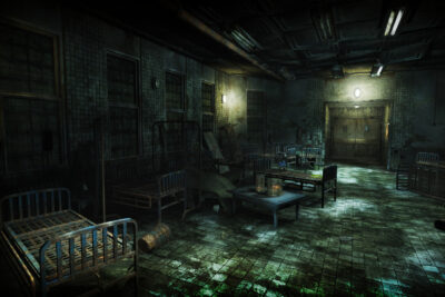An abandoned ward of the Hanwell Mental Institute with rusted bed frames and a lit doorway