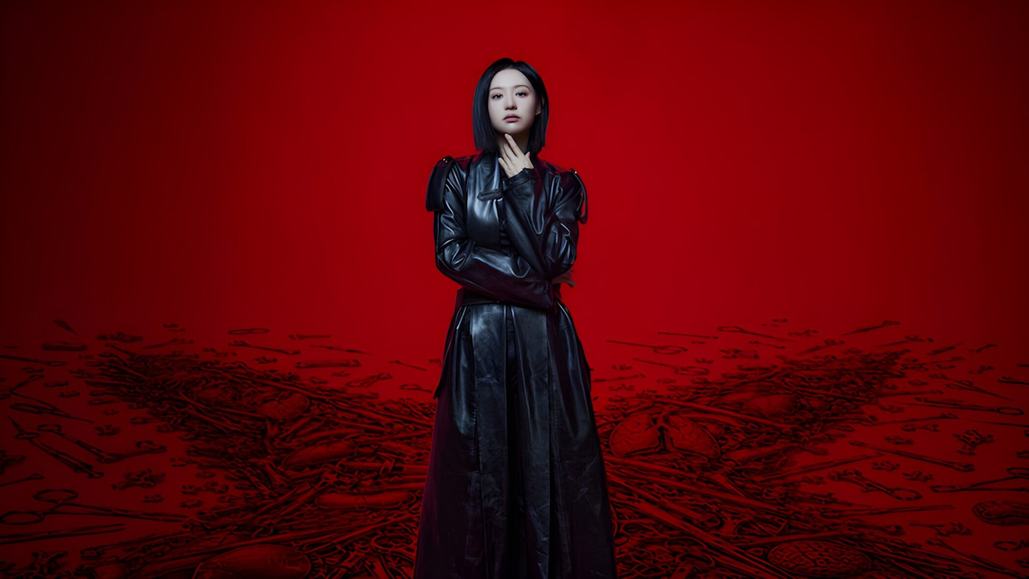 Kim Ji-won in a black leather coat against a red background in Doctor X: Mafia in White