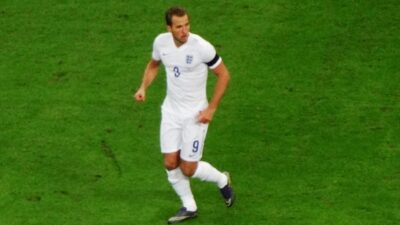 England captain Harry Kane in the white home shirt, running on the pitch
