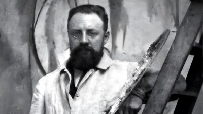 Henri Matisse with his palette, photographed in 1913