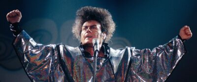 Gary Glitter performing on stage in archive footage from the Netflix documentary Hunting Gary Glitter