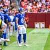 Jaxson Dart, number 6, on the New York Giants sideline