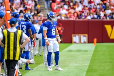 Jaxson Dart, number 6, on the New York Giants sideline