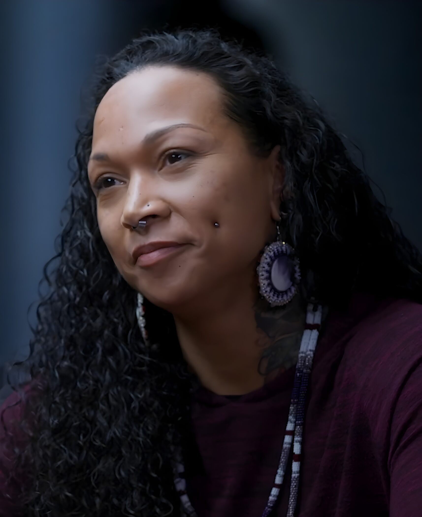 Kali Reis in a 2024 HBO interview for True Detective: Night Country, wearing beaded earrings